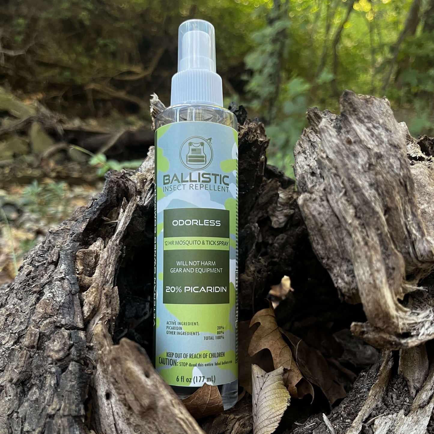 6 ounce bottle of Ballistic Insect Repellent outdoors in the woods